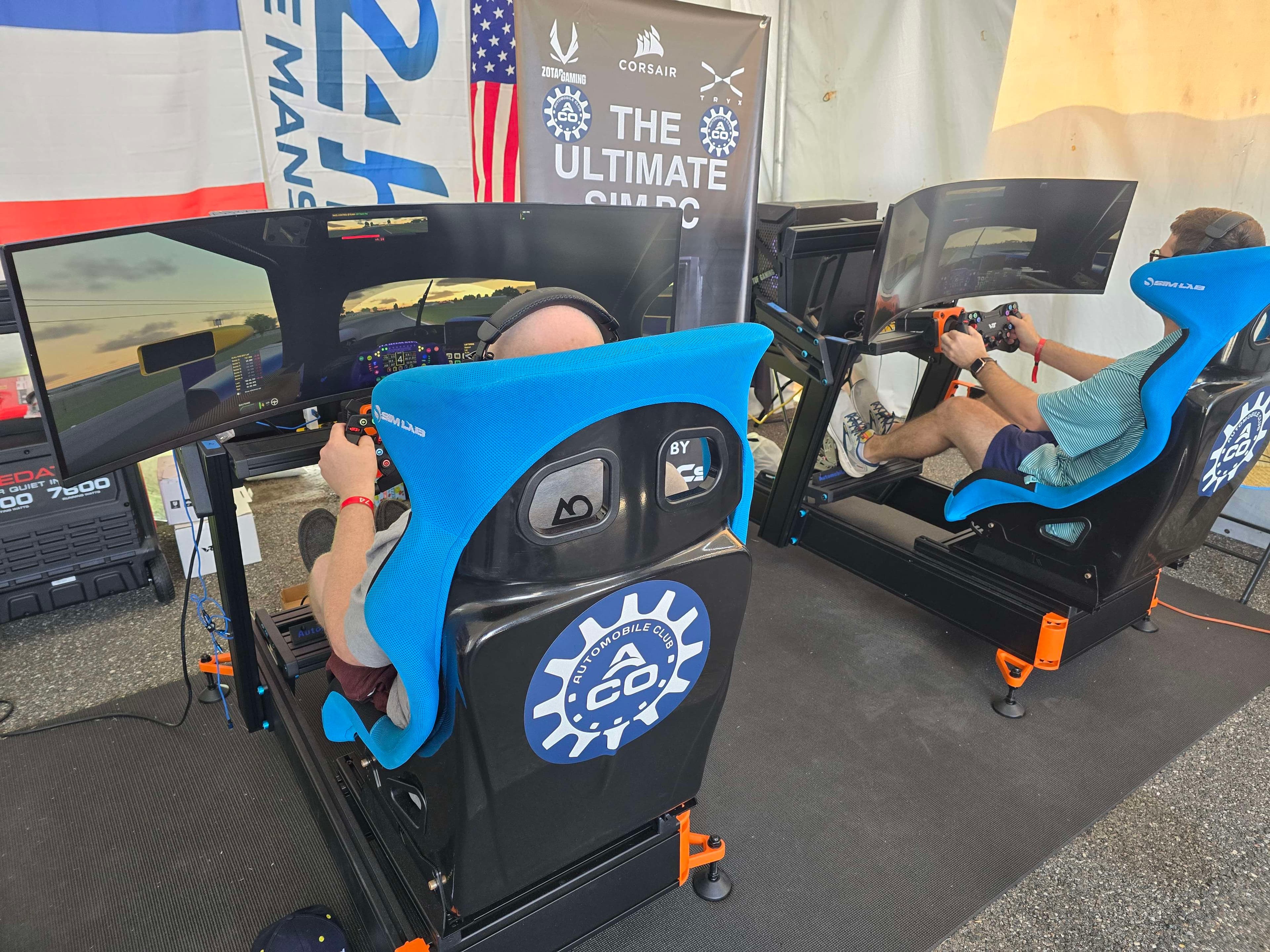 Sim racing program participants driving on professional simulators